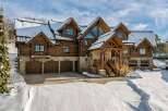 This stunning log cabin home offers a luxurious mountain living experience.