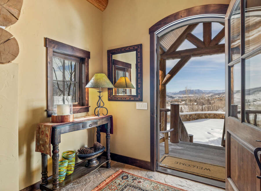 Step into luxury with this stunning property, showcasing a warm and inviting entryway.