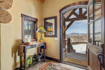Step into luxury with this stunning property, showcasing a warm and inviting entryway.