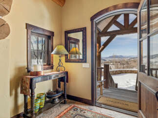 Step into luxury with this stunning property, showcasing a warm and inviting entryway.