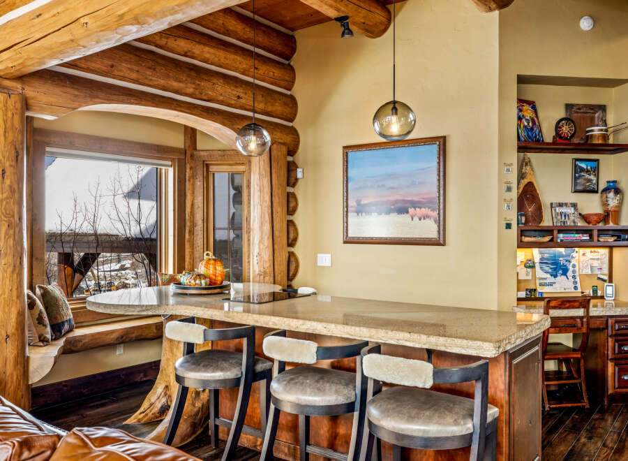 Step into rustic elegance with this stunning log cabin kitchen.