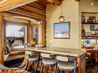 Step into rustic elegance with this stunning log cabin kitchen.
