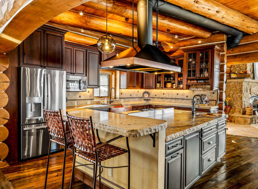 This stunning kitchen boasts a rustic yet modern design, perfect for entertaining and everyday living.