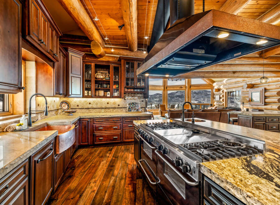 Step into luxury with this stunning kitchen! Featuring custom cabinetry, a professional-grade range, and a spacious island, this kitchen is perfect for both cooking and entertaining.