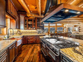 Step into luxury with this stunning kitchen! Featuring custom cabinetry, a professional-grade range, and a spacious island, this kitchen is perfect for both cooking and entertaining.