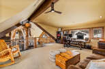 This stunning property boasts a unique loft-style design with exposed wooden beams and a cozy, inviting atmosphere.