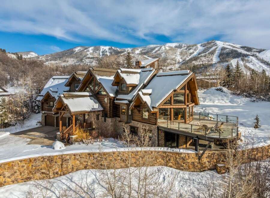 This stunning mountain home offers luxurious living with breathtaking views.