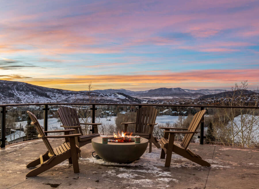 Enjoy breathtaking mountain views from this stunning outdoor living space.