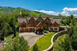 This stunning log home offers a luxurious mountain retreat with breathtaking views.