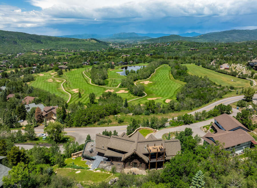 Discover luxury living in this stunning property with breathtaking views of a lush golf course and serene lake.
