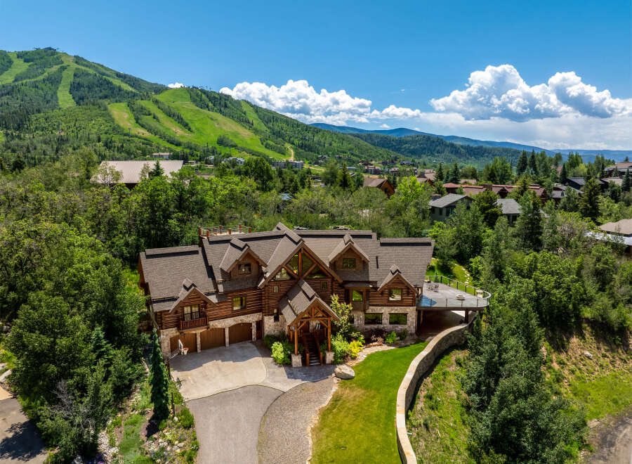 This stunning mountain home offers luxurious living with breathtaking views.
