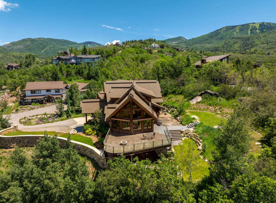 Nestled in a serene mountain landscape, this stunning property offers unparalleled views and luxurious living.