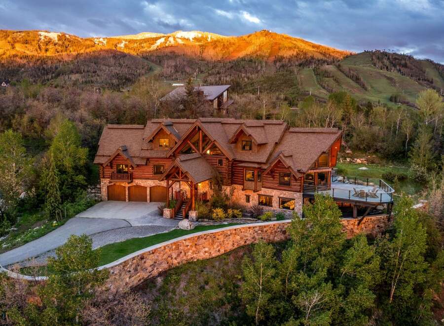 This stunning mountain home offers luxurious living with breathtaking views.