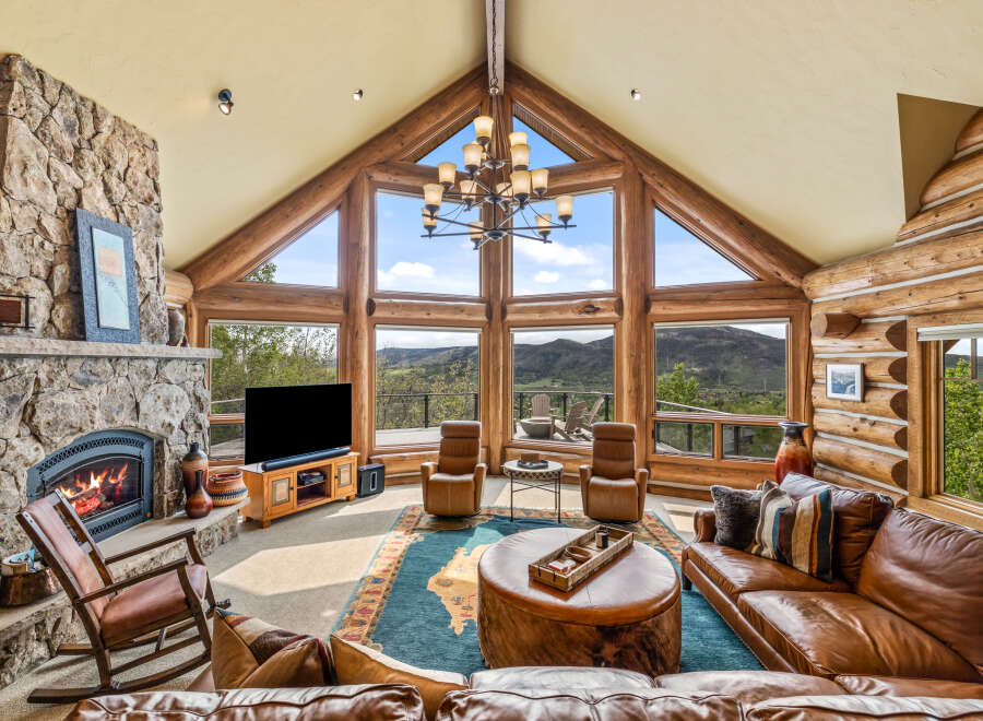 Experience luxury living in this stunning property featuring a cozy fireplace, perfect for chilly evenings.
