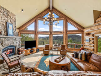 Experience luxury living in this stunning property featuring a cozy fireplace, perfect for chilly evenings.