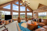 Experience luxury living in this stunning log cabin home, boasting breathtaking mountain views and an abundance of natural light.