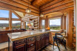 Experience the rustic charm of this stunning log cabin kitchen, perfect for entertaining and everyday living.