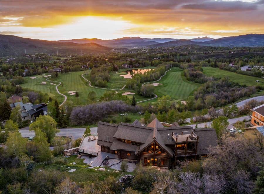 Experience luxury living in this stunning property, perfectly positioned with breathtaking views of a lush golf course and majestic mountains.