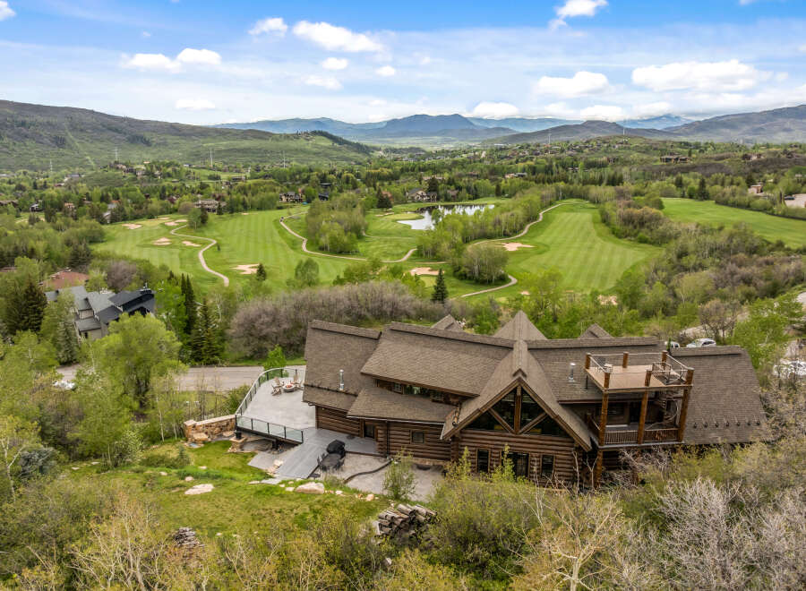 This stunning property boasts a luxurious log cabin design, offering a unique and inviting living experience.