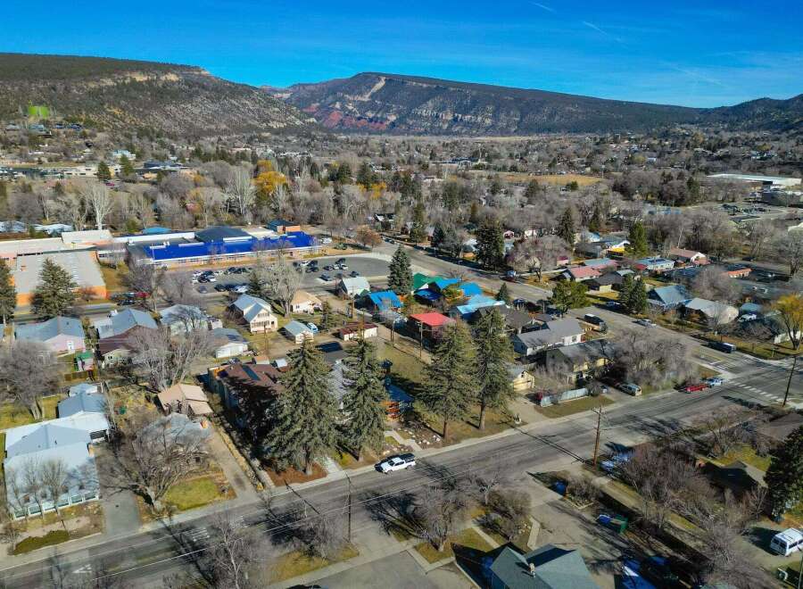 Discover the charm of this picturesque town nestled against a stunning mountain backdrop.