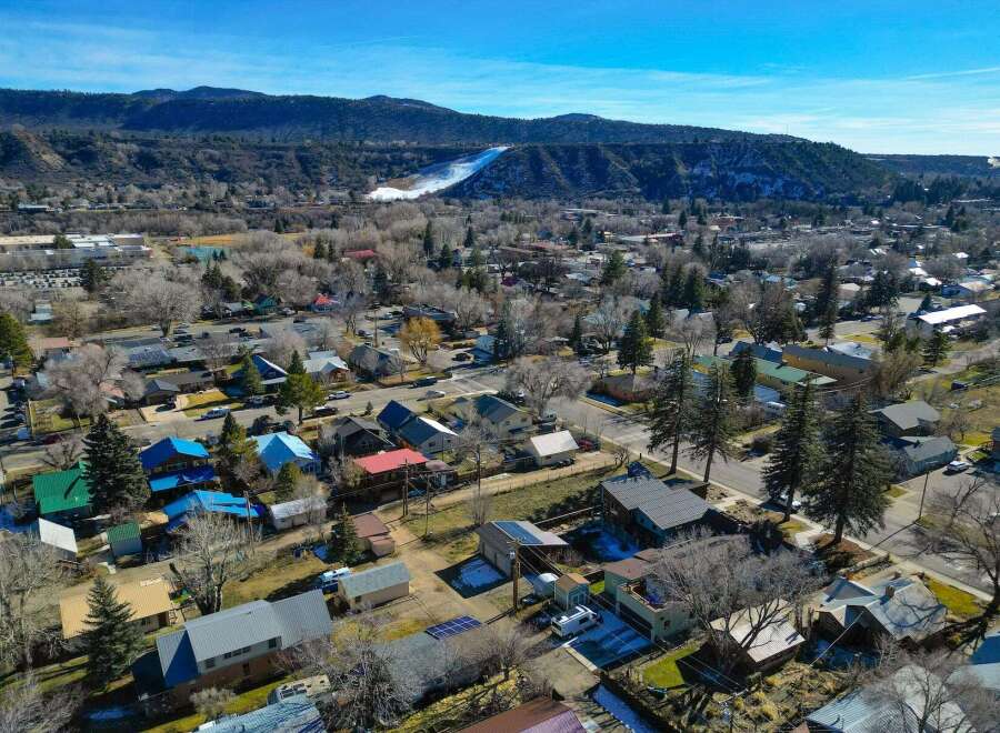 Discover the charm of this picturesque town nestled against a backdrop of majestic mountains.