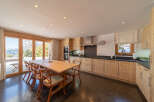 This stunning kitchen boasts a warm and inviting atmosphere, perfect for entertaining or enjoying family meals.