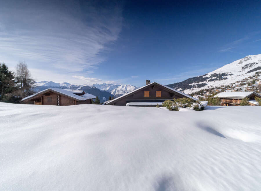 Nestled in a picturesque winter wonderland, this charming property offers a serene escape.