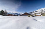 Nestled in a picturesque winter wonderland, this charming property offers a serene escape.