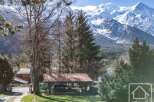 Discover a stunning property nestled in a picturesque mountain setting.