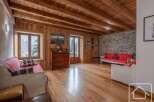 This stunning property boasts a warm and inviting interior, featuring beautiful wooden floors and ceilings that create a cozy atmosphere.