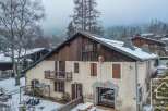 Discover this charming property nestled in a serene, snow-covered landscape.