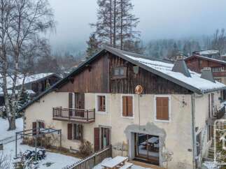 Discover this charming property nestled in a serene, snow-covered landscape.