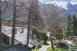Discover a charming property nestled in a picturesque mountain setting.