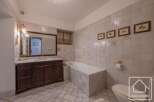 This elegant bathroom features a classic design with a touch of rustic charm.