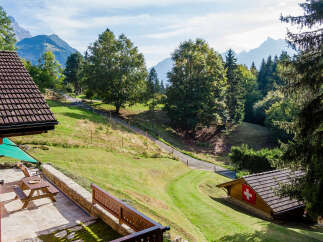 Discover your dream retreat in this charming property nestled amidst breathtaking mountain scenery.