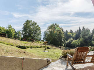 Enjoy breathtaking views from this stunning property! This home features a spacious outdoor area with comfortable seating, perfect for relaxing and taking in the natural beauty.