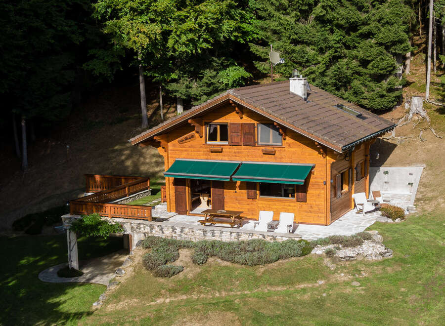 Nestled in a serene forest setting, this charming wooden cabin offers a perfect blend of rustic charm and modern comfort.
