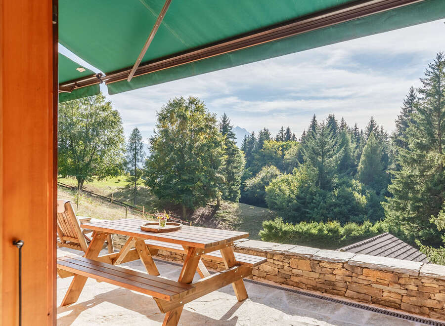 Enjoy breathtaking mountain views from this charming property.