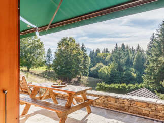 Enjoy breathtaking mountain views from this charming property.