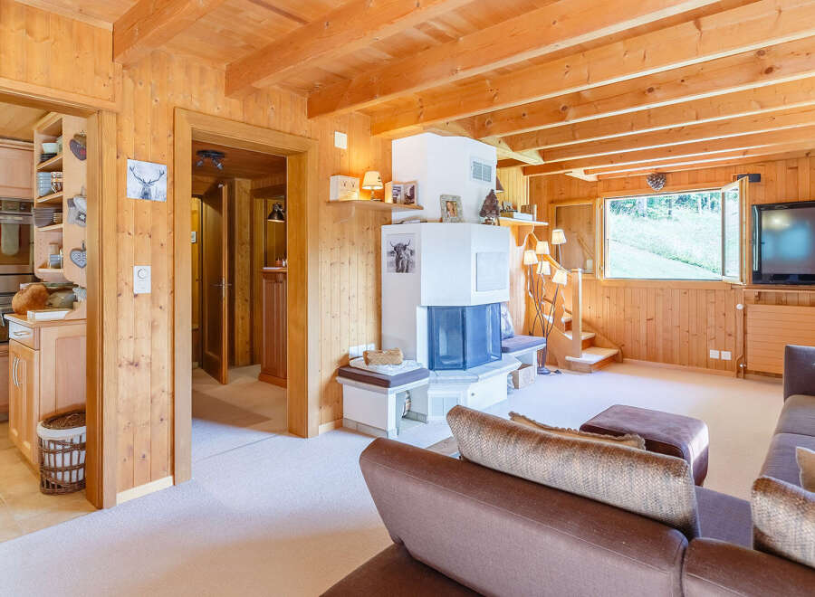 This charming property features a cozy living room with a fireplace and a comfortable seating area.