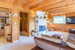 This charming property features a cozy living room with a fireplace and a comfortable seating area.