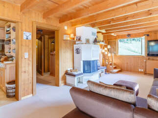 This charming property features a cozy living room with a fireplace and a comfortable seating area.