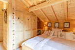 This cozy bedroom features a charming wooden interior, creating a warm and inviting atmosphere.