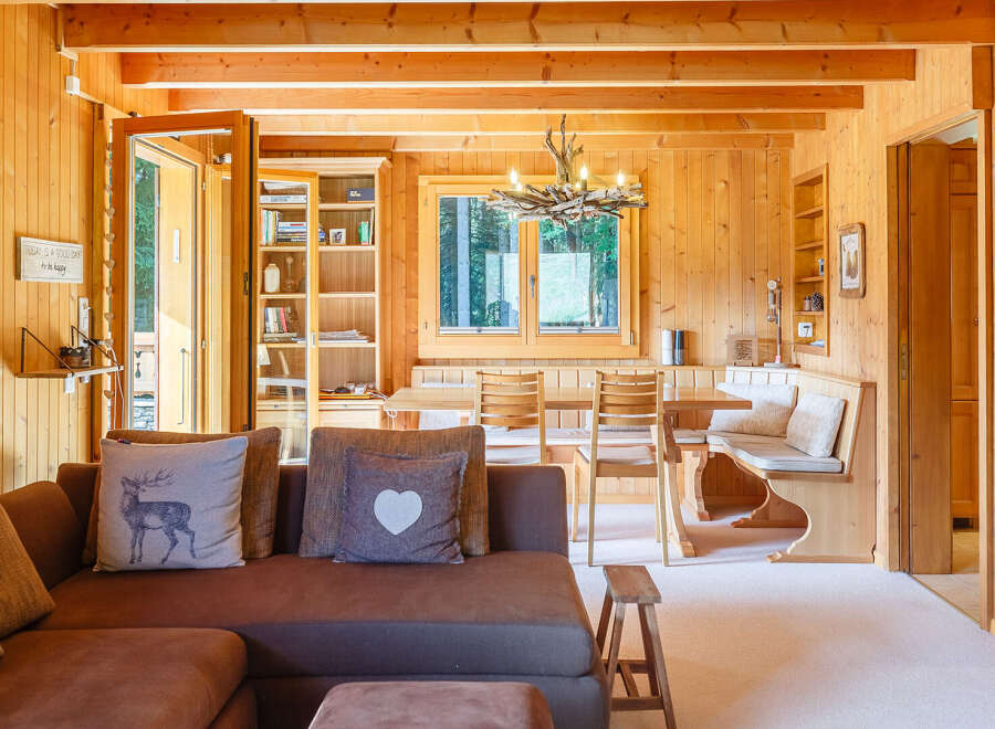 Step into this inviting cabin retreat, showcasing warm wood paneling and a cozy atmosphere.