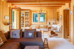 Step into this inviting cabin retreat, showcasing warm wood paneling and a cozy atmosphere.