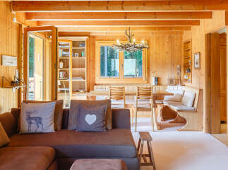 Step into this inviting cabin retreat, showcasing warm wood paneling and a cozy atmosphere.
