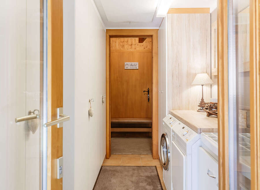 Step into this charming chalet and discover a well-designed laundry area.