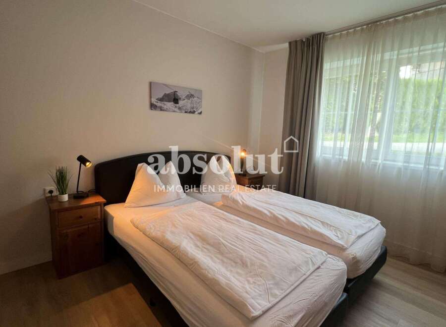 Discover a cozy bedroom featuring two comfortable beds, perfect for a relaxing stay.