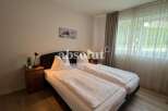 Discover a cozy bedroom featuring two comfortable beds, perfect for a relaxing stay.