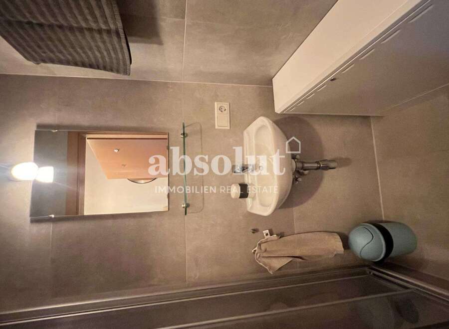 Discover this modern bathroom featuring sleek design elements and functional amenities.